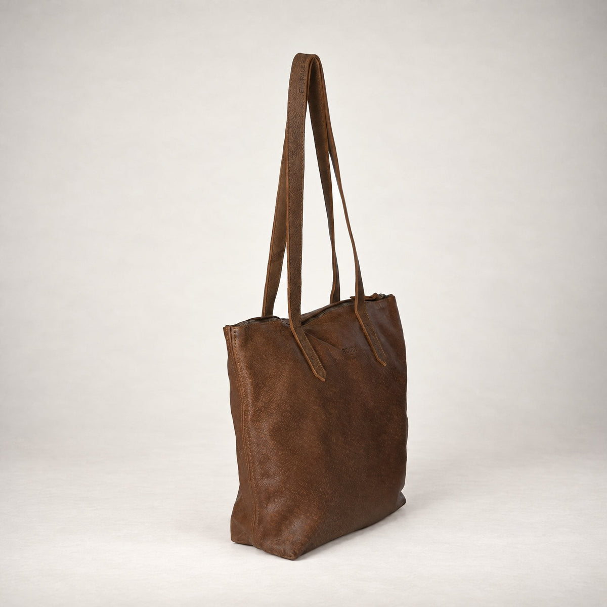 Rowdy Leather Tote Bag in Mountain (velvety nubuck leather), three-quarter view showing the zip top
