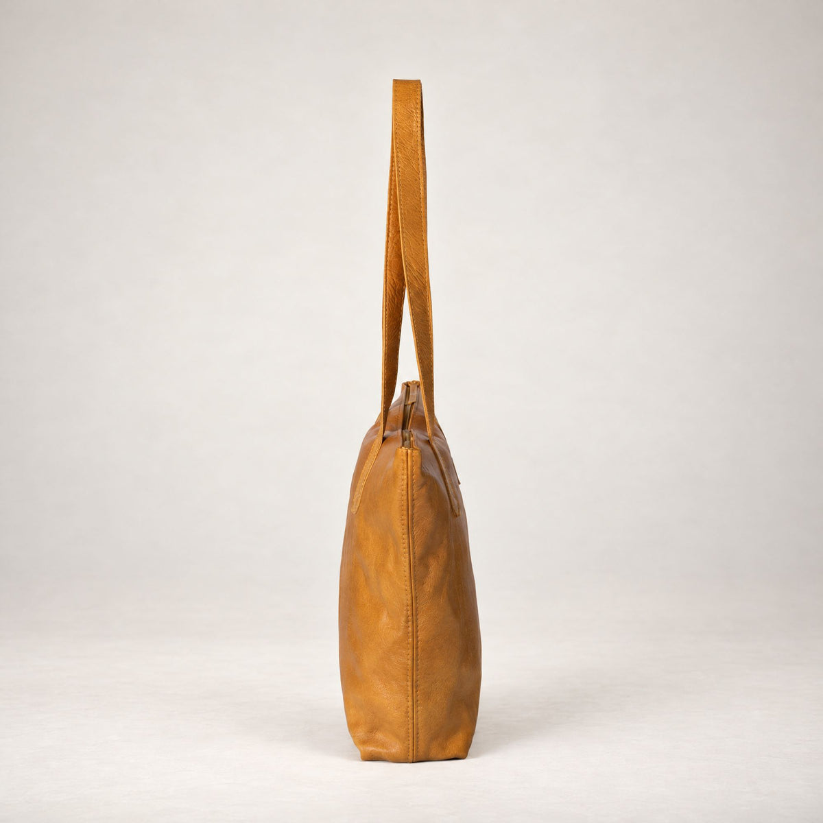 Rowdy Leather Tote Bag in Amber (smooth aniline leather), side view