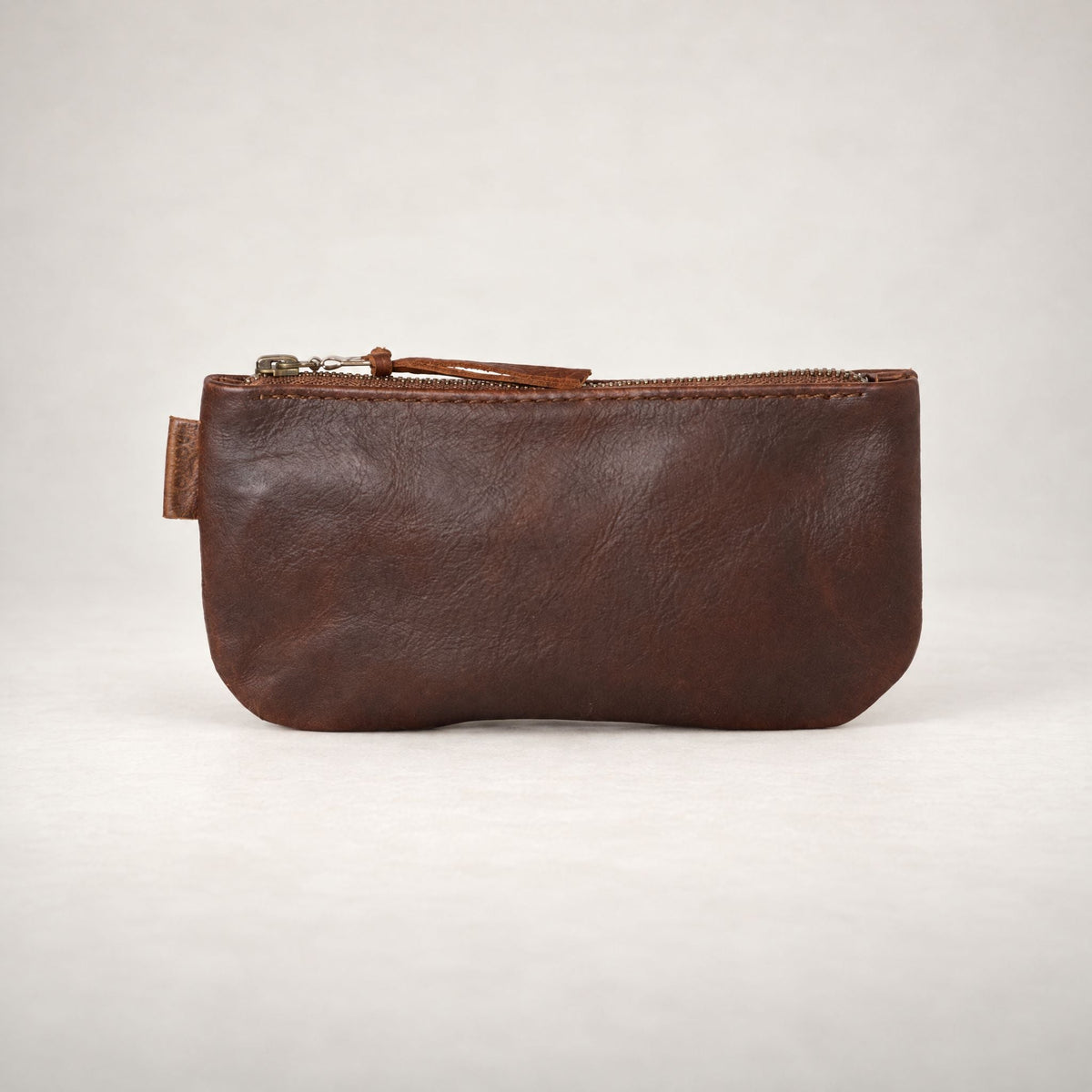 Rowdy leather Travel Pouch in Maple (smooth aniline leather), with a full-length zip, for passport, phone and cards