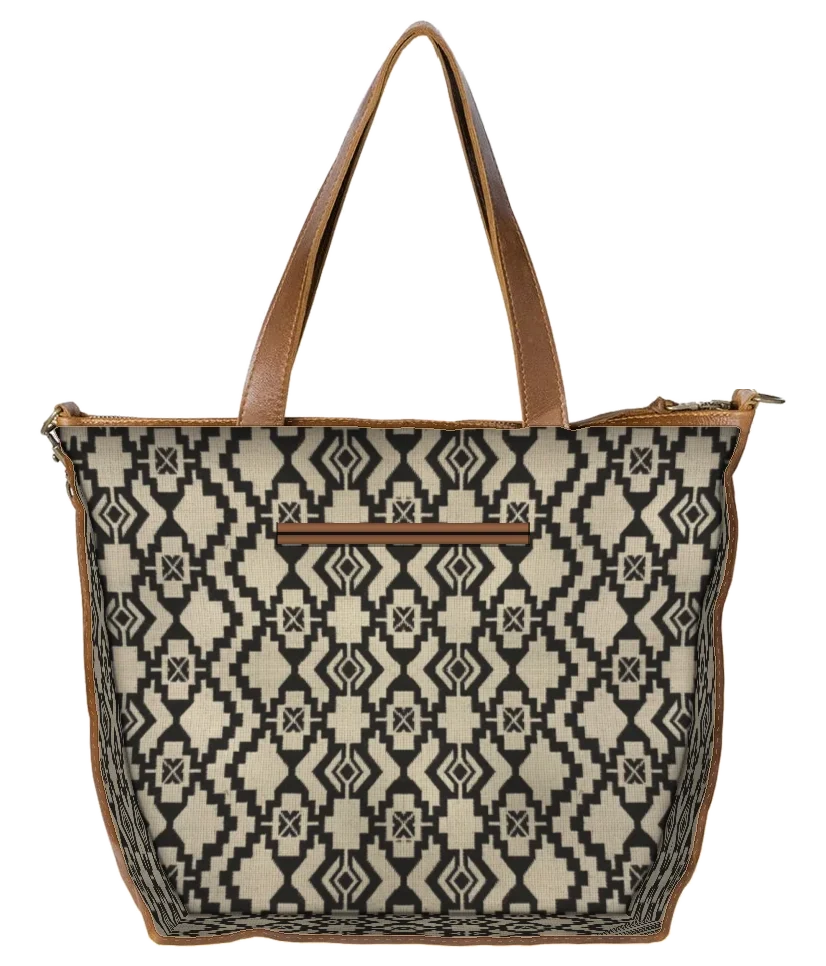 Leather Crossbody Bag in Cedar cut open along the seam, showing the printed lining and leather-bound inner sleeve