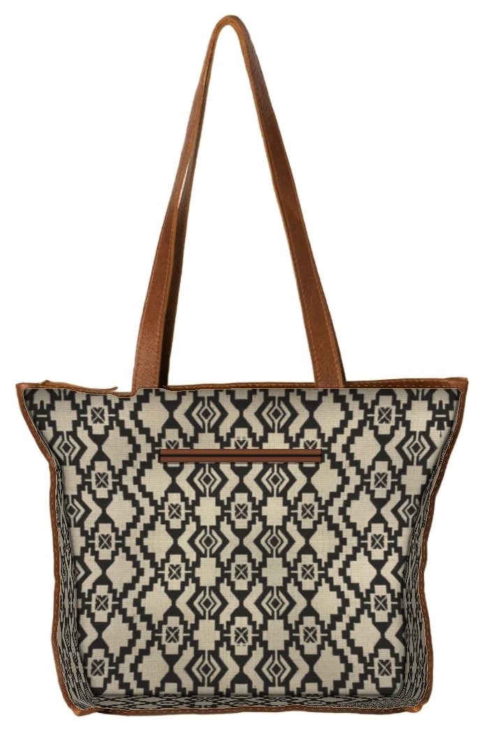 Leather Tote Bag in Cedar cut open along the seam, showing the printed lining and leather-bound inner sleeve